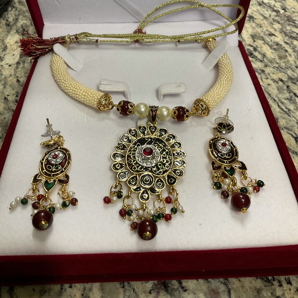 white pearls necklace, golden pendant & earrings